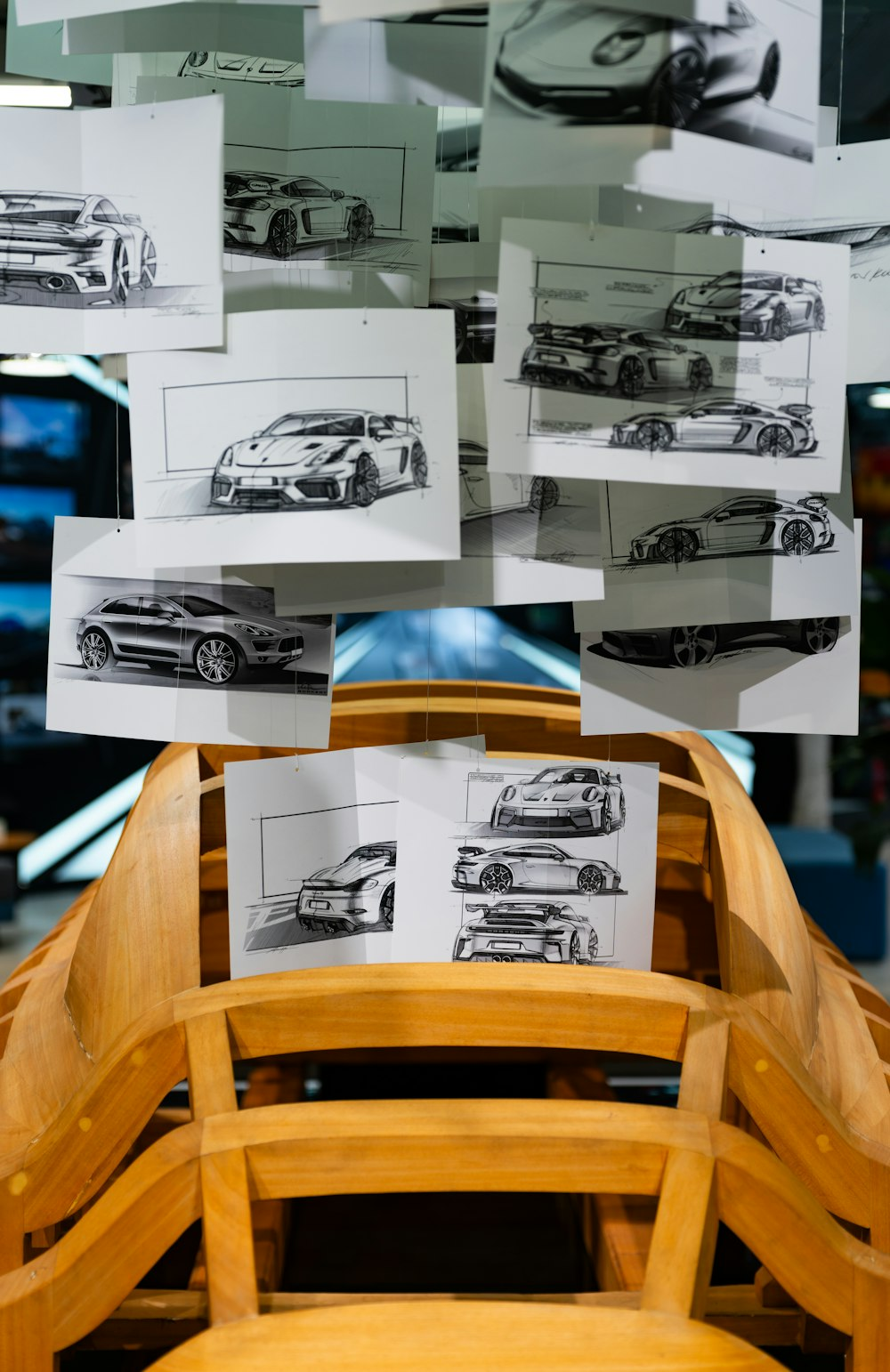 Vehicle design sketches pinned up in a design studio